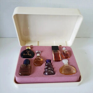 Vintage 1980s set of 7 Mini Perfumes in Plastic Case.